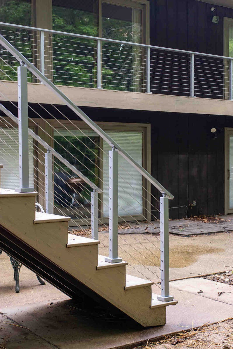 arola custom deck cable railing staircase side view