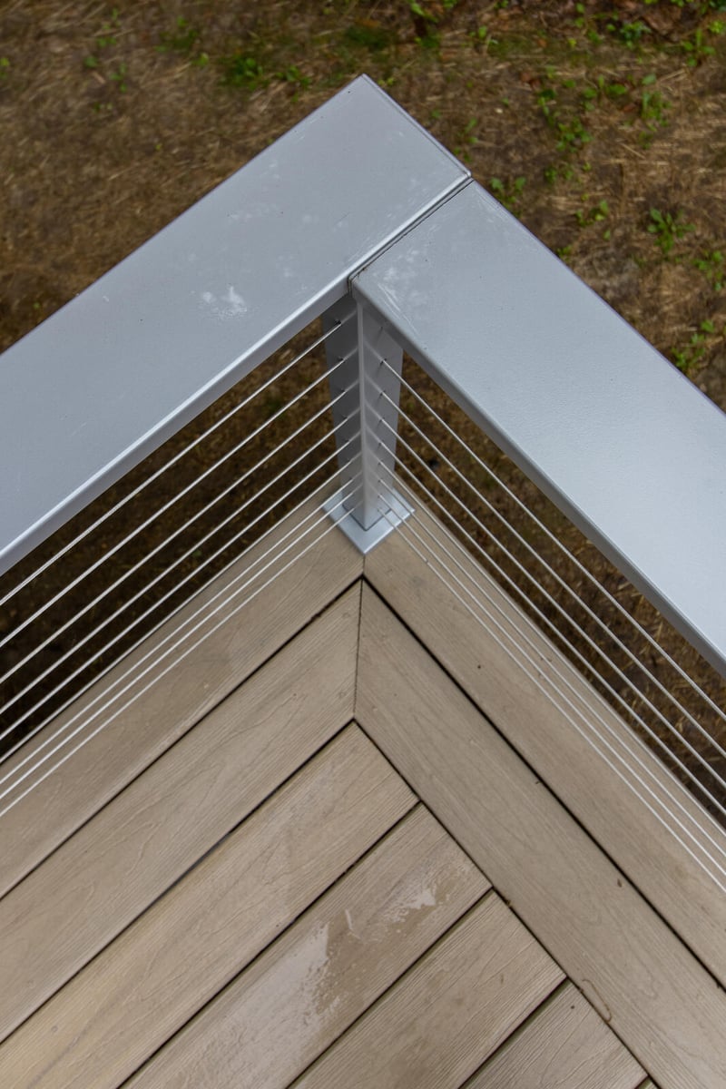 arola custom deck corner post closeup grass background