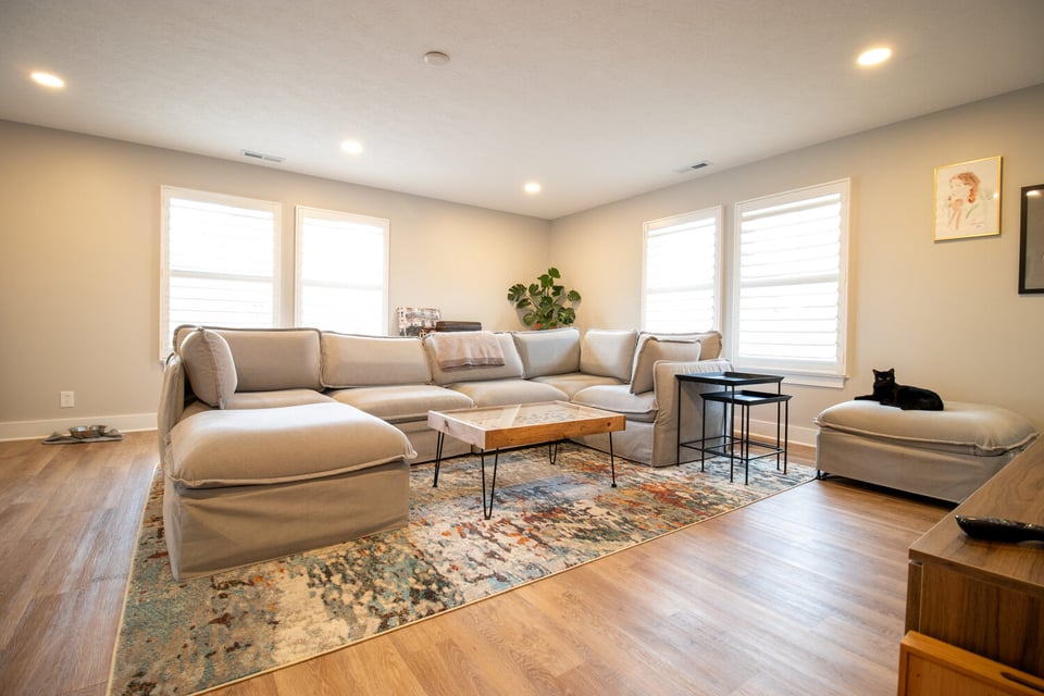 Spacious open-concept living area with natural light in custom home project by S. Brown Construction Co. in Buck Creek, IN.