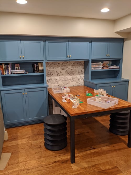 Creative kids’ workspace with built-in shelving and LEGO play area in a custom home by S. Brown Construction Co. in Bar Barry Heights, IN.