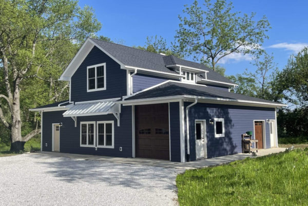 Blue detached custom garage and living quarters with white trim by S. Brown Construction Co. in Lafayette, IN.