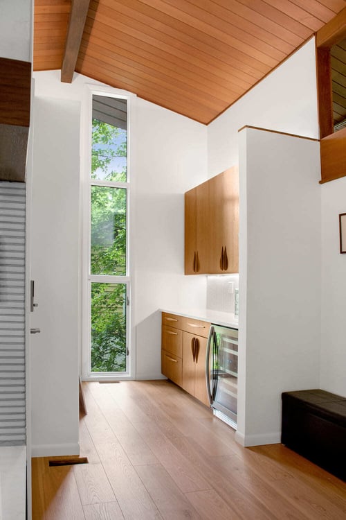 Beverage station with custom light and cabinets and statement ceiling in Lafayette