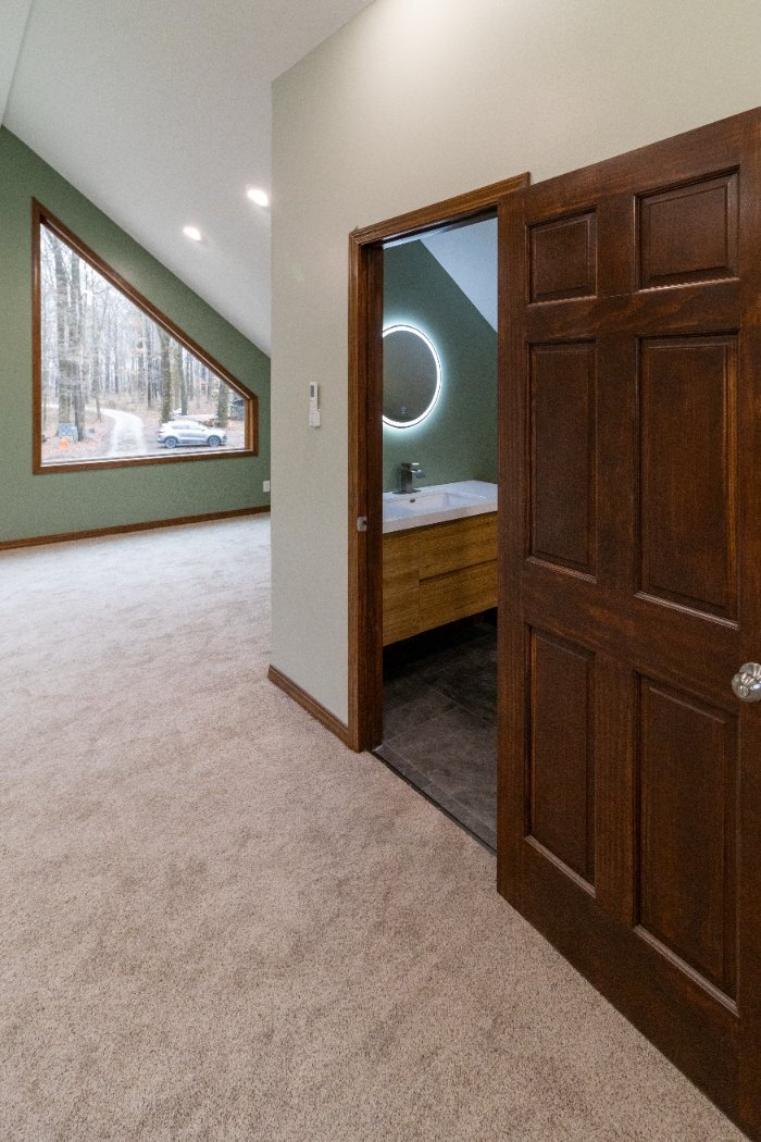 S. Brown Construction Co. Schoon Garage Addition upper-level bonus room featuring custom windows and bathroom access in Lafayett-optimized