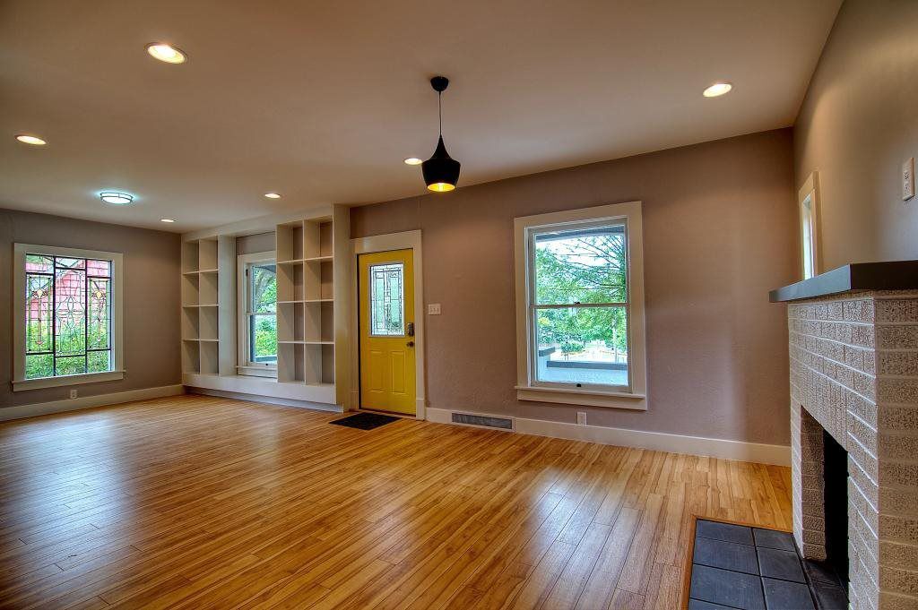 Living room remodel in Bar Barry Heights, IN by S. Brown Construction Co. featuring built-in shelving and fireplace.