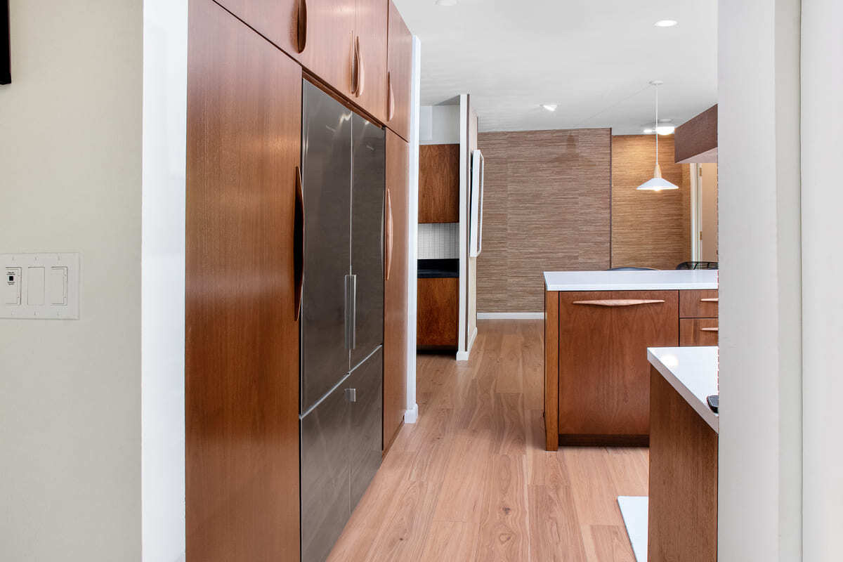 View of refrigerator set into custom cabinets in Lafayette kitchen remodel