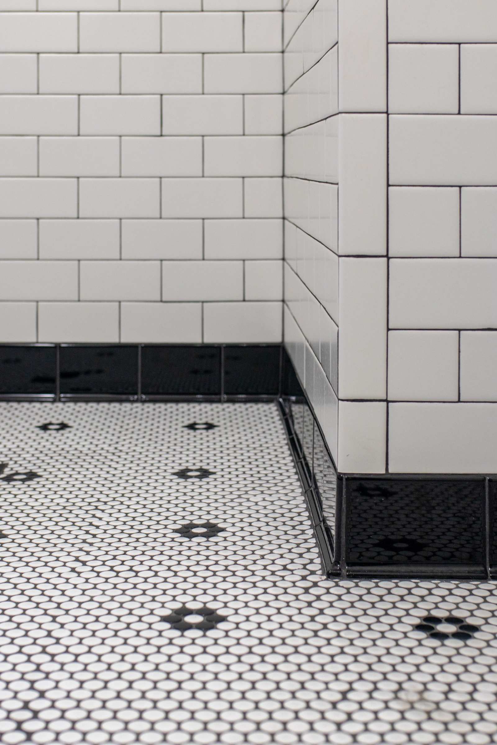 Bathroom tile floor with penny tile pattern in Lafayette, IN remodel by S. Brown Construction Co.