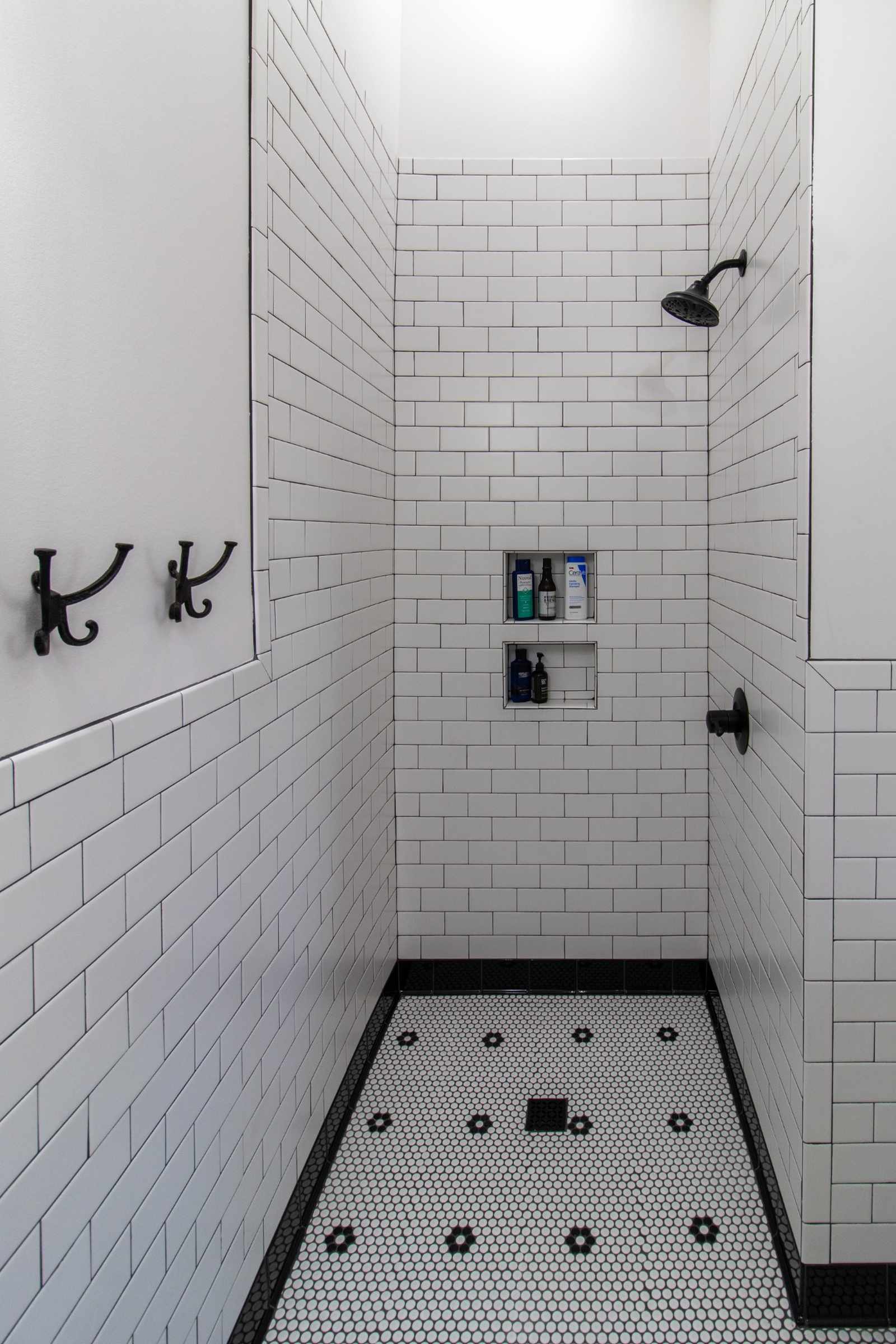 custom tiled shower with niche shelving in bathroom remodel by S. Brown Construction Co. West Lafayette IN