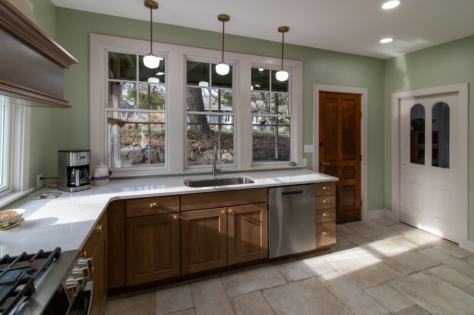 wide kitchen view with sink, dishwasher, and wood cabinets by S. Brown Construction Co. in Lafayette IN