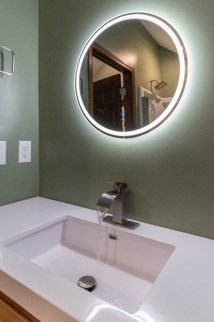 modern bathroom sink and illuminated mirror in the Schoon Garage Addition by S. Brown Construction Co. in Lafayette, IN.-optimized modern bathroom sink and illuminated mirror in the Schoon Garage Addition by S. Brown Construction Co. in Lafayette, IN.-optimized